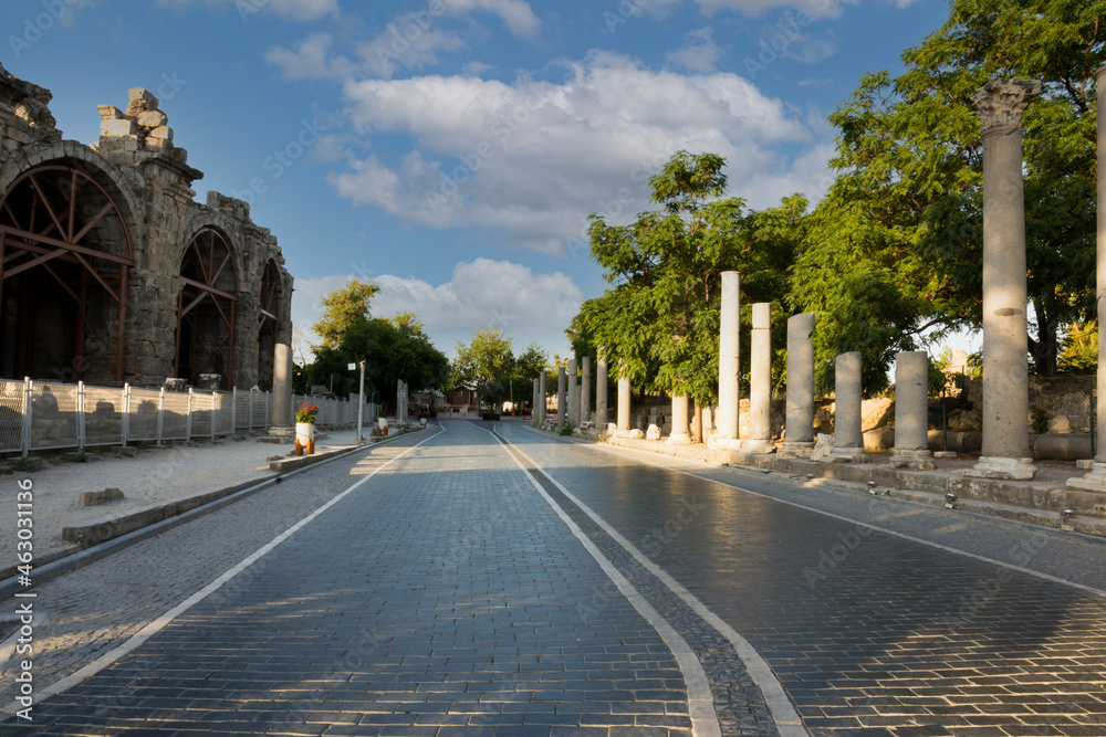 ancient theater exterior, Antalya Side. road and columns. no people. sunset sky. cloudy spring day. Selective focus.