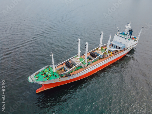 Red-green ship at sea, fishing ship or coast guard