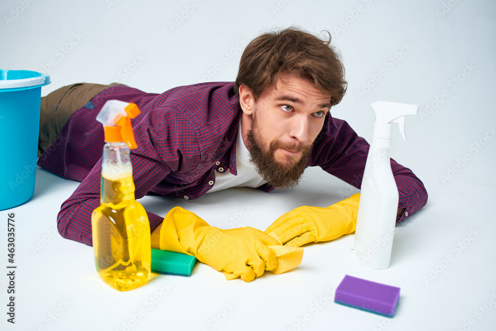 man with detergent cleaning the apartment hygiene home care man with detergent cleaning the apartment hygiene home care