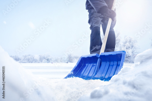 Person using a snow shovel in winter