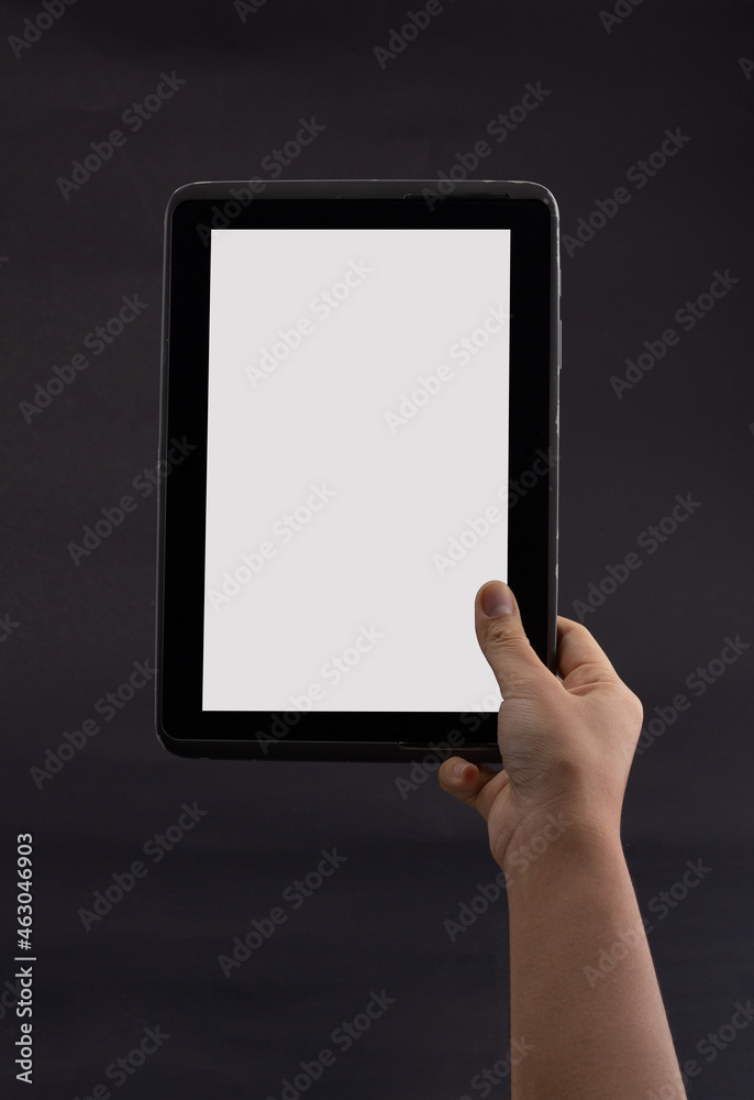 hand holding smartphone in vertical isolated on black background. Customers can put ads, website pages or information that they want to be displayed on the phone screen. hand holding smartphone in vertical isolated on black background. Customers can put ads, website pages or information that they want to be displayed on the phone screen.