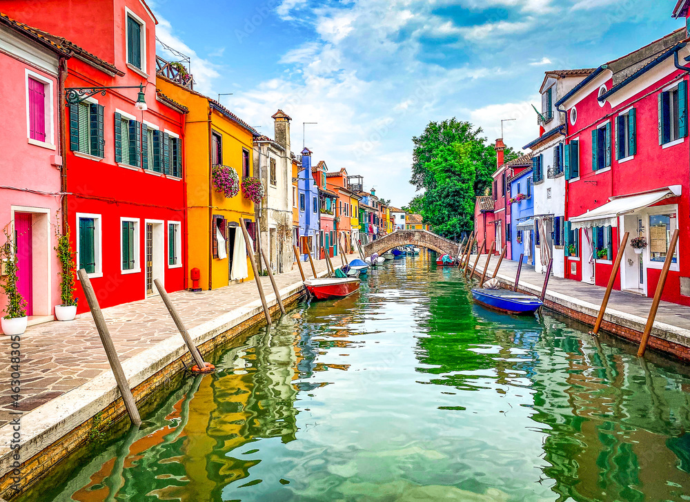Boats and colorful traditional painted houses in a canal street houses of Burano island, Venice, Italy - obrazy, fototapety, plakaty 