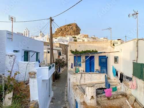 Pedestrian street of Greek Chora village built around a large rock on Amorgos island, Aegean Sea, Cyclades, Greece
