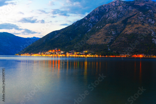 Perast coast town at Kotor Bay in Montenegro  . Evening view of illuminated Perast old town  photo