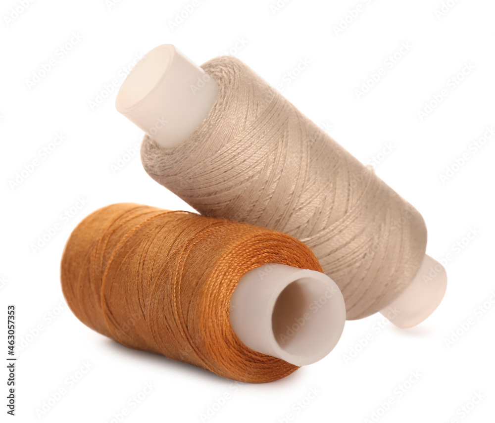 Different colorful sewing threads on white background Different colorful sewing threads on white background