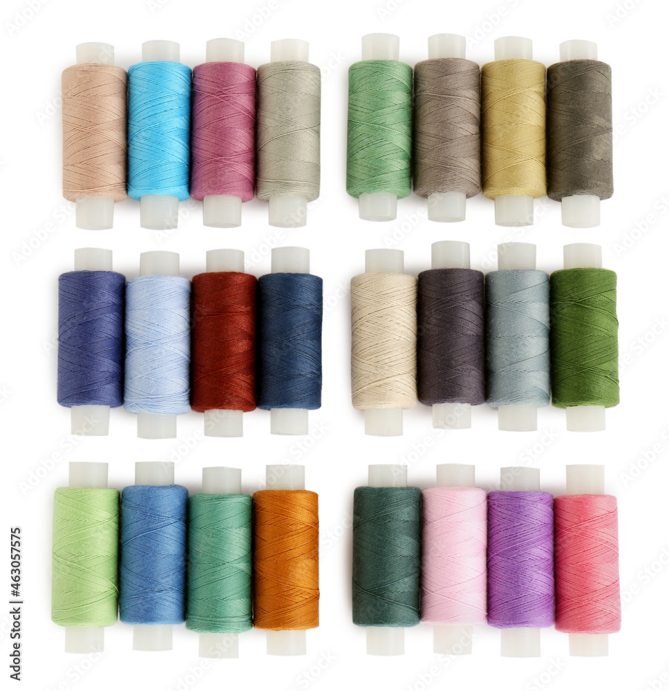 Set of colorful sewing threads on white background, top view Set of colorful sewing threads on white background, top view