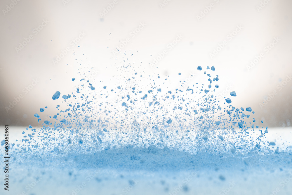 Obraz premium explosion of flour and components, lifting them into the air on a white surface