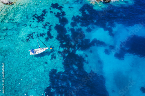 Aerial view of lonely yacht boat in secluded remote beach on the Ionian island of Kefalonia, Greece © Igor Tichonow