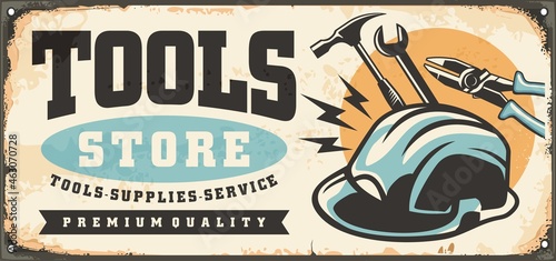 Tools shop vintage inscription sign with safety helmet, hammer, wrench and pliers. Retro sign for hardware store with various work tools and equipment. Vector ad illustration.