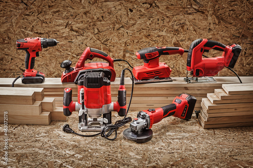 Electrric Hand Tools Set On Background Of Plywood.