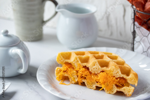 Thai foi thong waffles in white plate and coffee mug snack concept