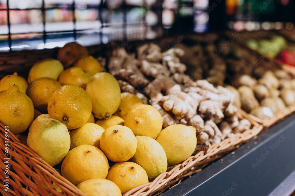 Lemons in basket in grocery store