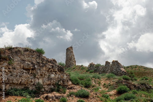 Ruins of an ancient fortress. An old wall of large stones. The remains of a former civilization.