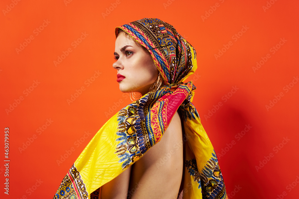 pretty woman ethnicity multicolored headscarf makeup glamor red background