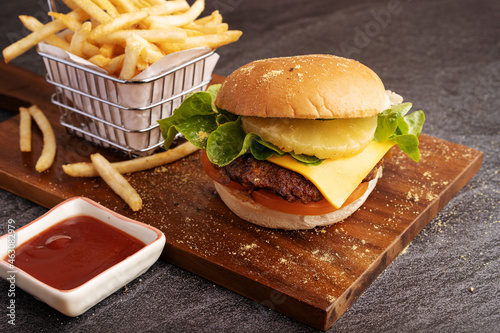 Pineapple beef burger serves with chips