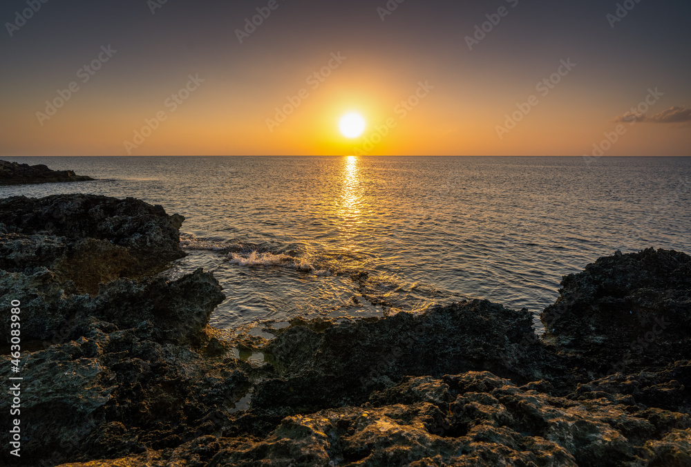 Beautiful sunrise over the rocky coast of the Mediterranean sea