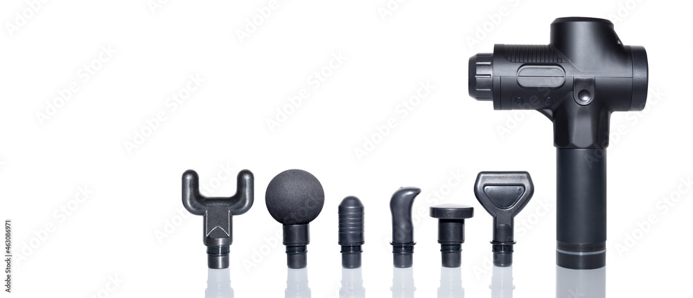 Percussion massager of deep muscle tissues for athletes, relaxes relieves pain. Handheld wireless professional therapeutic shock massage gun. Massager attachments