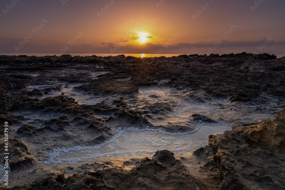 Sunrise over the rocky coast of the Mediterranean Sea