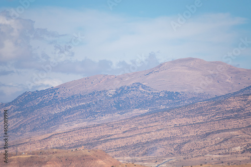 Scenic view of Old stone houses, Palm trees Oasis , Mountains from Ghoufi Canyon in the Aures region, Algeria