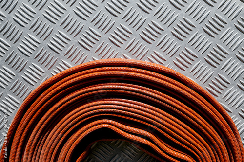 Roll of red fire hose