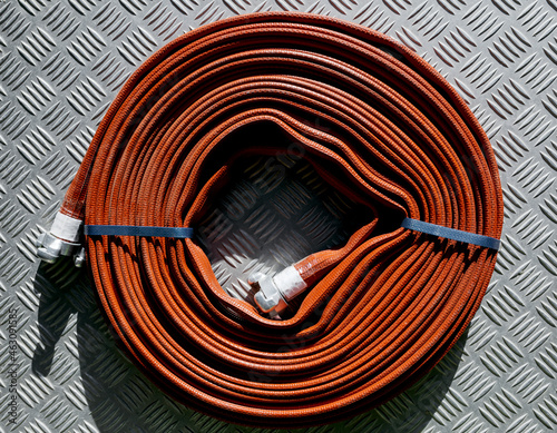 Roll of red fire hose
