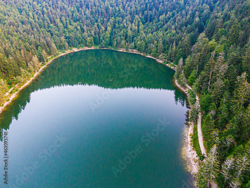 Aerial view of the Lac des corbeaux surrounded by forest, Voges, La Bresse, Lake Crows photo