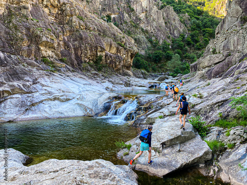 Group of Unrecognizable Peoples walking to go canyoning in Chassezac gorges photo