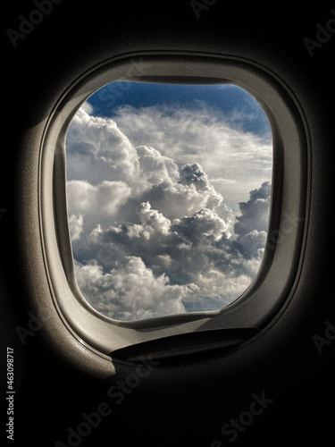 Cloudscape seen through an airplane window flying