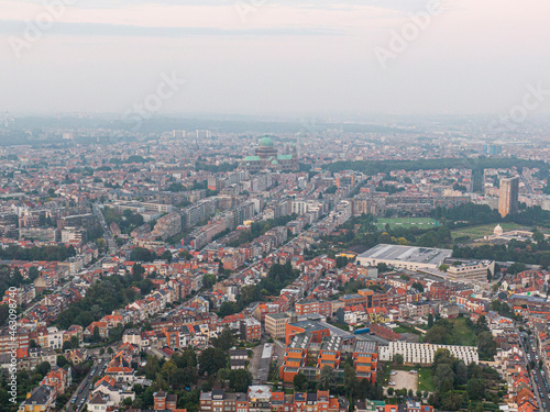 Fototapeta Naklejka Na Ścianę i Meble -  Aerial panorama view of Brussels-Capital Region and suburban area in the foreground. View from Ganshoren municipality during grey sunset