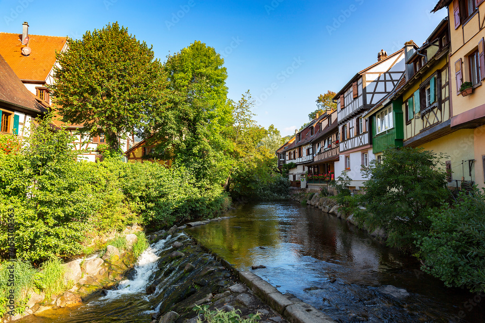 River with ancient colourful buildings in old town of Kaysersberg, Alsace, France