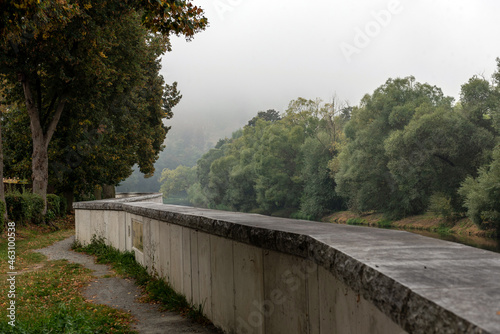 flood barrier along the river and trees around