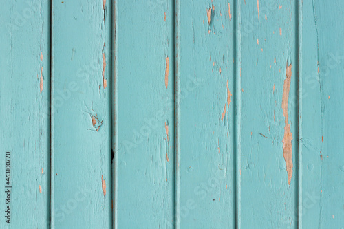 Texture photo of worn blue paint colored wooden boards.