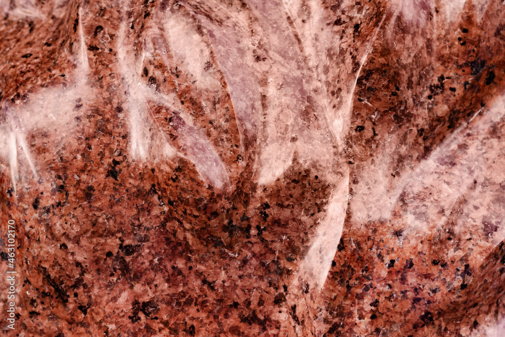 Close-up photo texture of red marble statue surface.