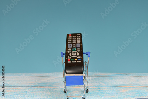 TV remote control in a consumer trolley. Provision of information services. photo