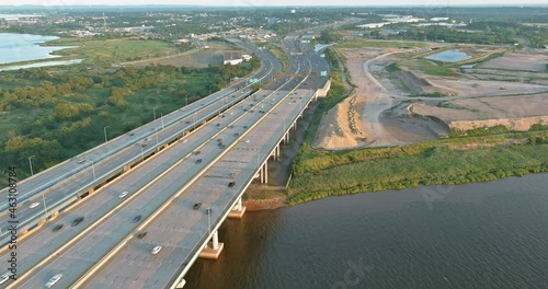 Aerial view of vehicles driving on Alfred E. Driscoll Bridge a huge complex road junction at the entrance connected for Sayreville town New Jersey photo