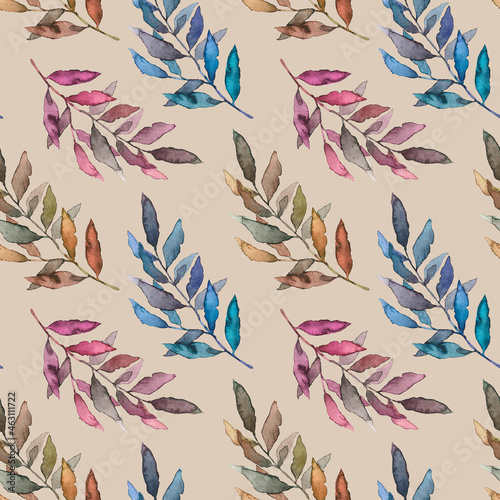 Seamless pattern with leaves of different colors on a beige background.