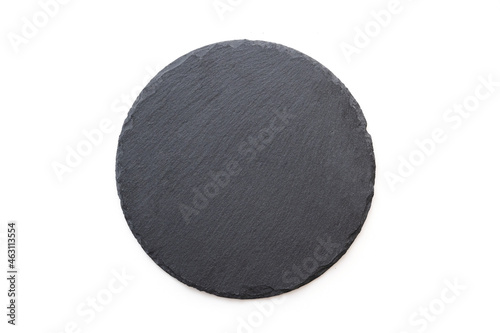 Round slate plate, black slate board isolated on white. Top view