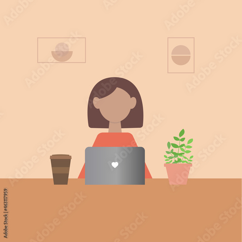 The girl is working at a laptop and drinking coffee