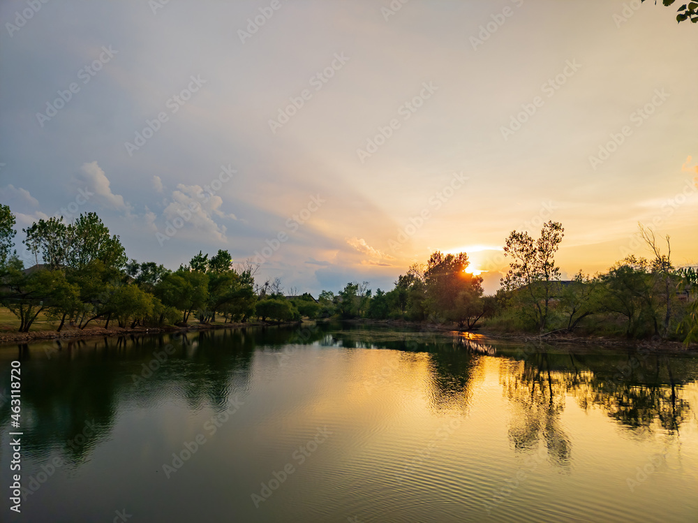 Beautiful sunset lake landscape in a community park