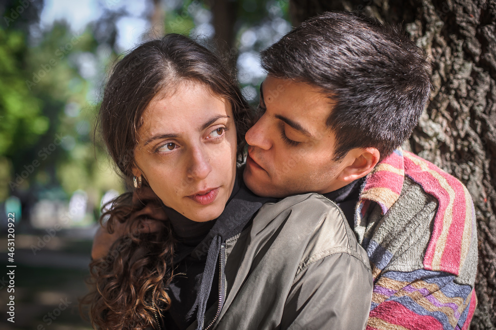 Cheerful and romantic couple hugging and enjoying in in love Cheerful and romantic couple hugging and enjoying in in love
