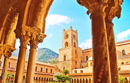 The shady arcade in garden of Monreale Cloister is the nice place to enjoy the medieval art, Sicily, Italy photo
