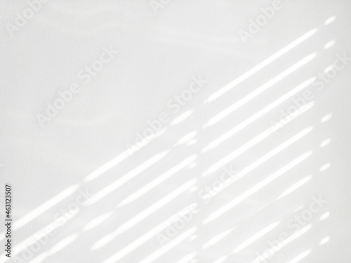 Shadows on wall. Abstract light  black shadow overlay from window on white texture wall. Sunlight architecture background. For product presentation  backdrop and mockup  summer seasonal concept.