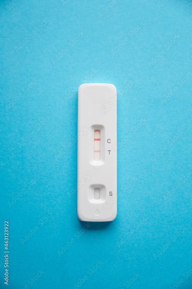 Coronavirus antigen test kit, with a negative result on a blue background. Copy space. Coronavirus antigen test kit, with a negative result on a blue background. Copy space.