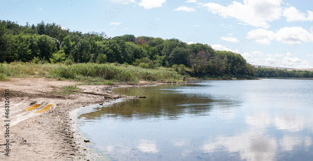 A lonely pine tree. Relict salt lake Tambukan. The place of extraction of therapeutic mud. Stavropol Territory, Russia A lonely pine tree. Relict salt lake Tambukan. The place of extraction of therapeutic mud. Stavropol Territory, Russia