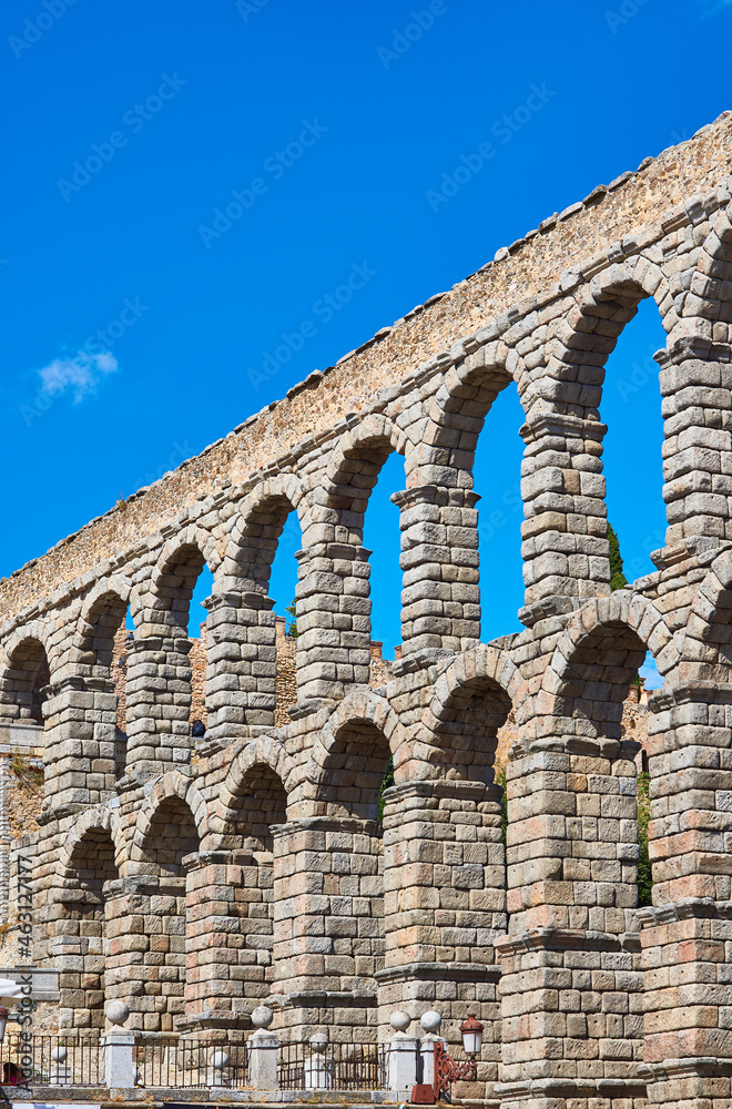 Aqueduct of Segovia, one of the largest in the Roman world, built during the Flavian dynasty; detail of the two monumental rows of arches. View from Azoguejo square. Segovia, Castile and Leon, Spain.