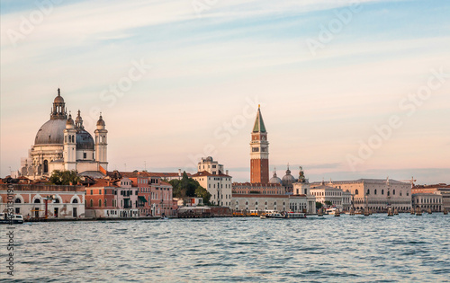 Towers and lagoon of Venice under blue evening sky. Historical landscape with old buildings of the ancient italian city