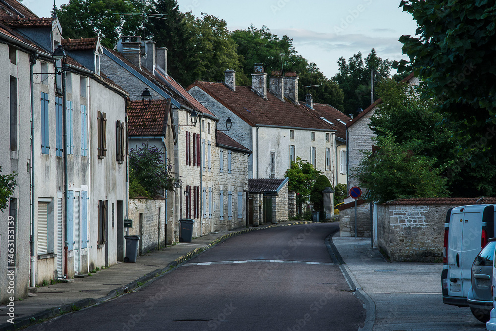 streets with parked cars in the small village of Arc en Barrois in the French Champagne Ardenne in the evening streets with parked cars in the small village of Arc en Barrois in the French Champagne Ardenne in the evening