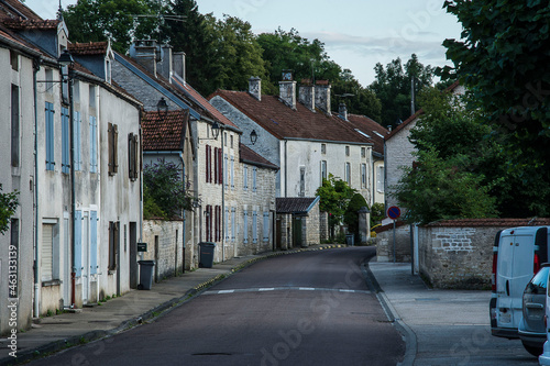 Fototapeta Naklejka Na Ścianę i Meble -  streets with parked cars in the small village of Arc en Barrois in the French Champagne Ardenne in the evening