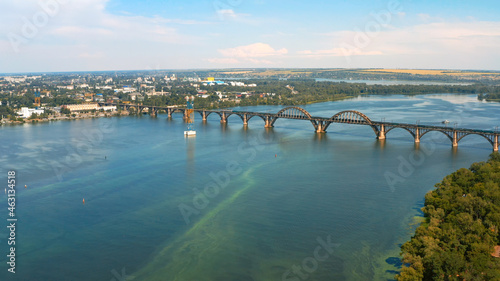 Wallpaper Mural Aerial photo - Beautiful city landscape with a river. Photo of a beautiful long bridge over the river from the throne. Urban environment with a wide river. Torontodigital.ca