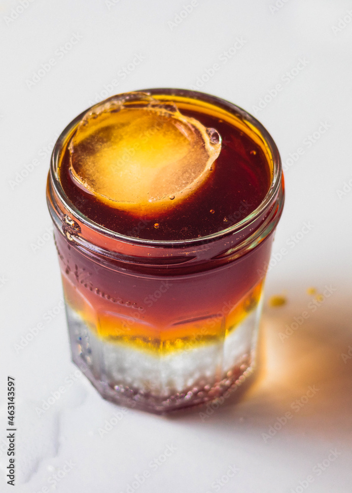 Coffee tonic close up with spill Coffee tonic close up with spill